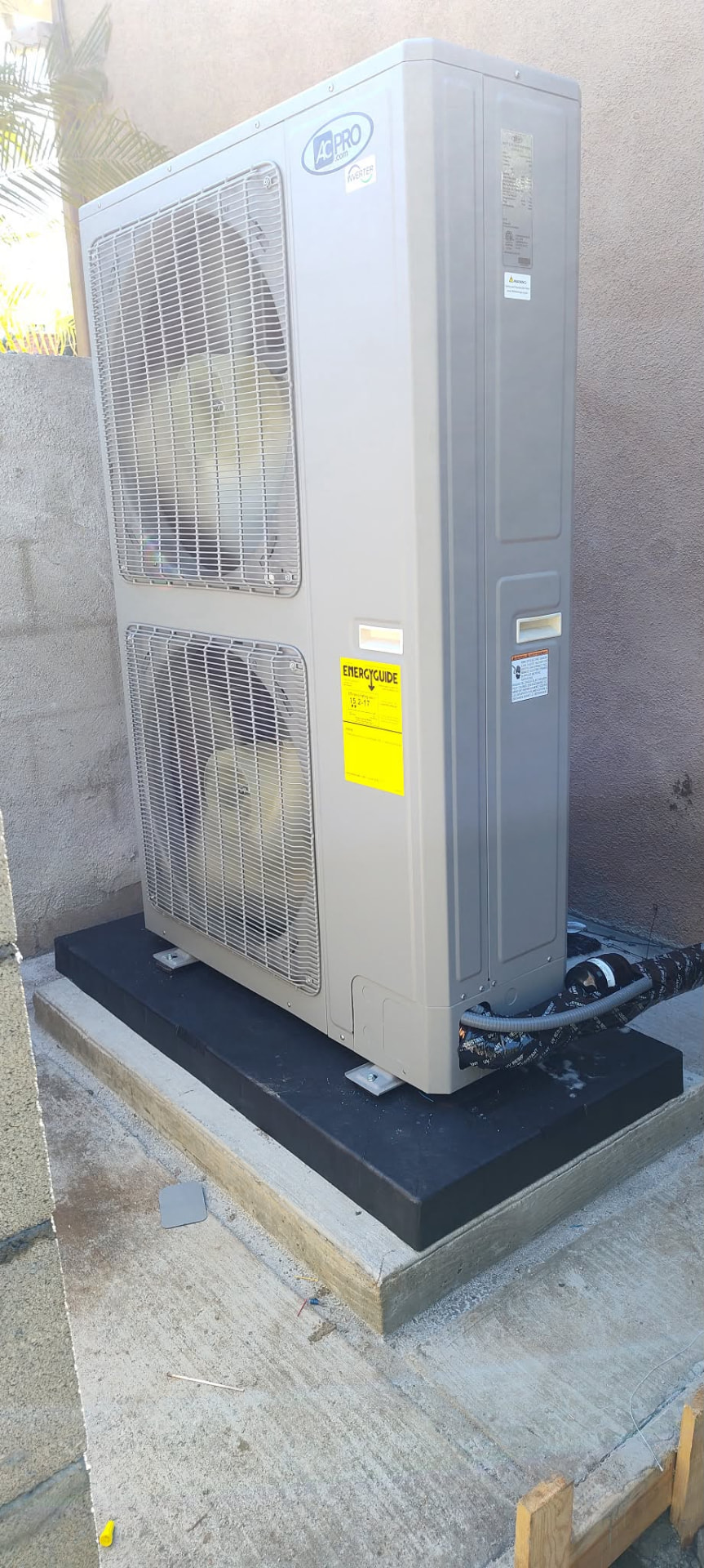 AC Pro inverter condenser on an isolated pad with sealed line set